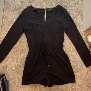 Black romper, c. Luce, medium, gathers around wrist. Worn once